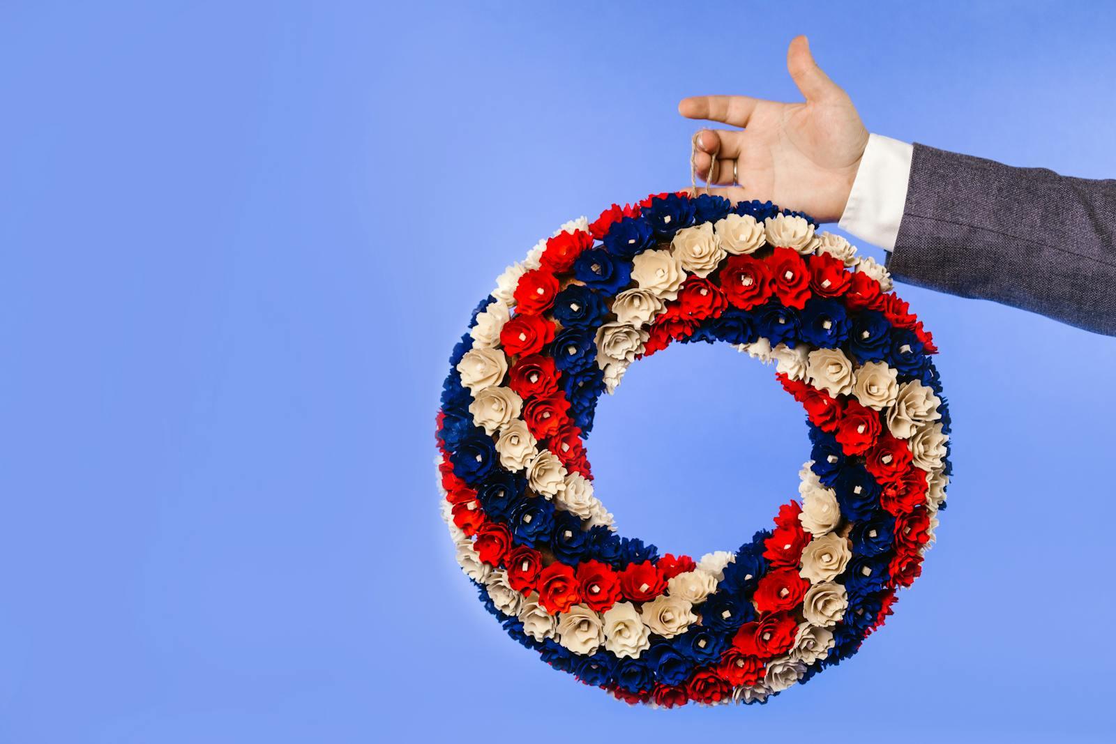Patriotic red, white, and blue welcome-home bouquet with American flag ready for delivery from Sedalia, MO to Whiteman Air Force Base and Knob Noster