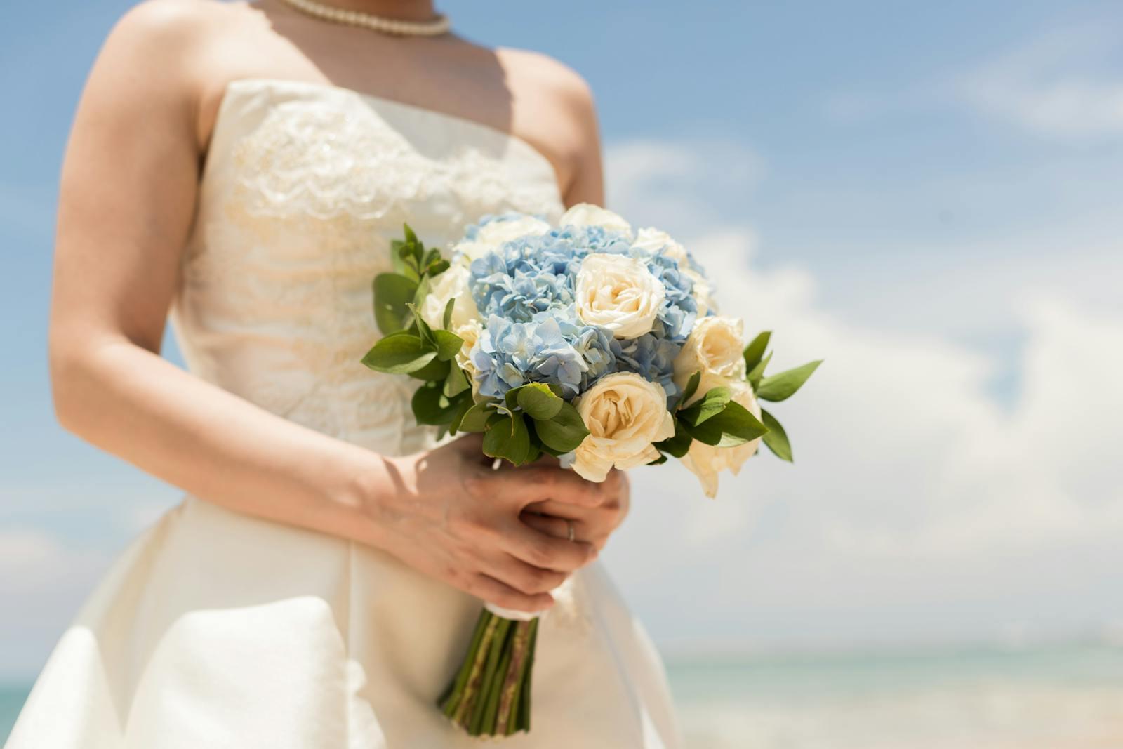 Asymmetrical summer wedding bouquet with garden roses, dahlias, draping amaranthus, and citrus accents for a Sedalia, MO June bride