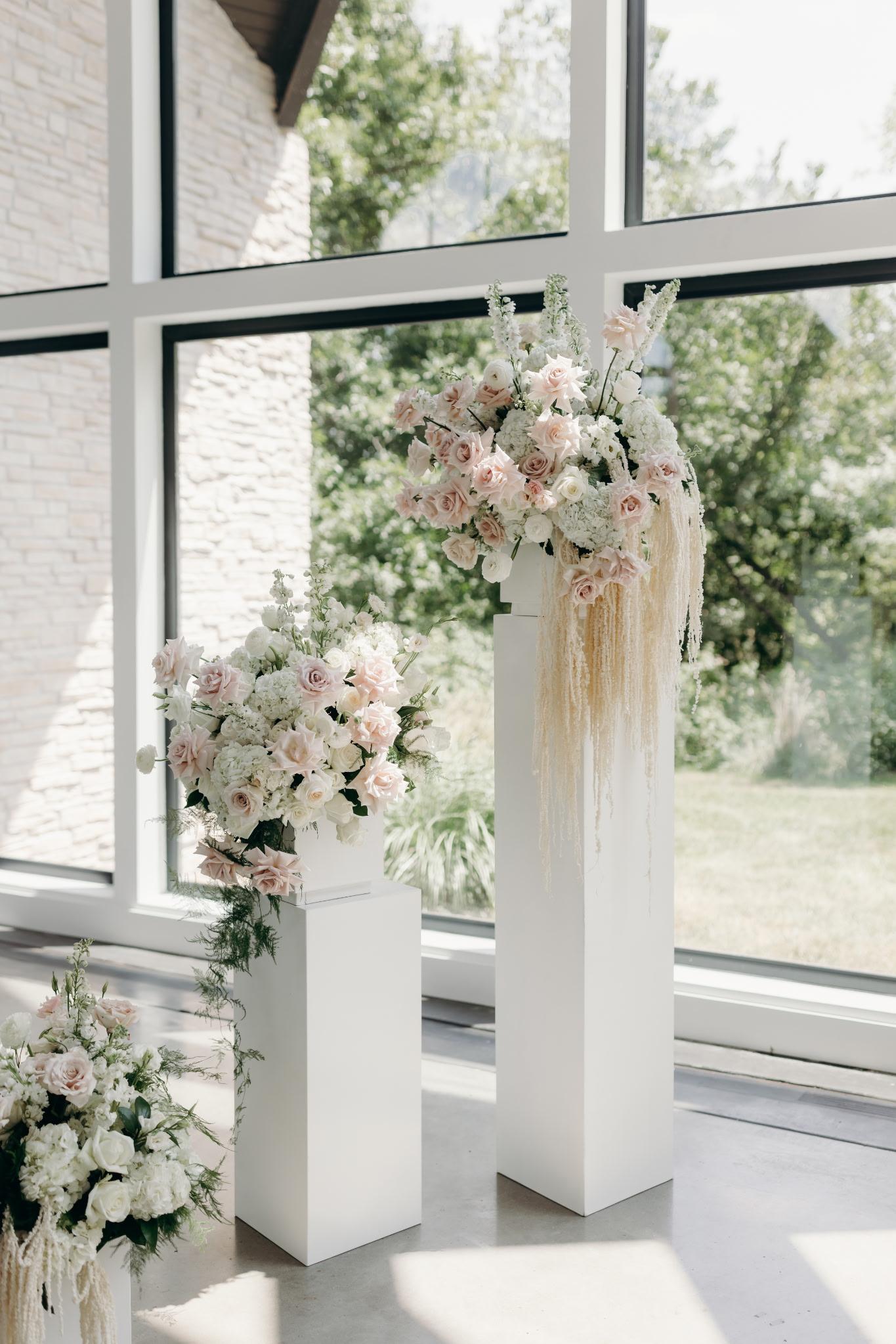 Detail of cascading amaranthus on a pedestal arrangement