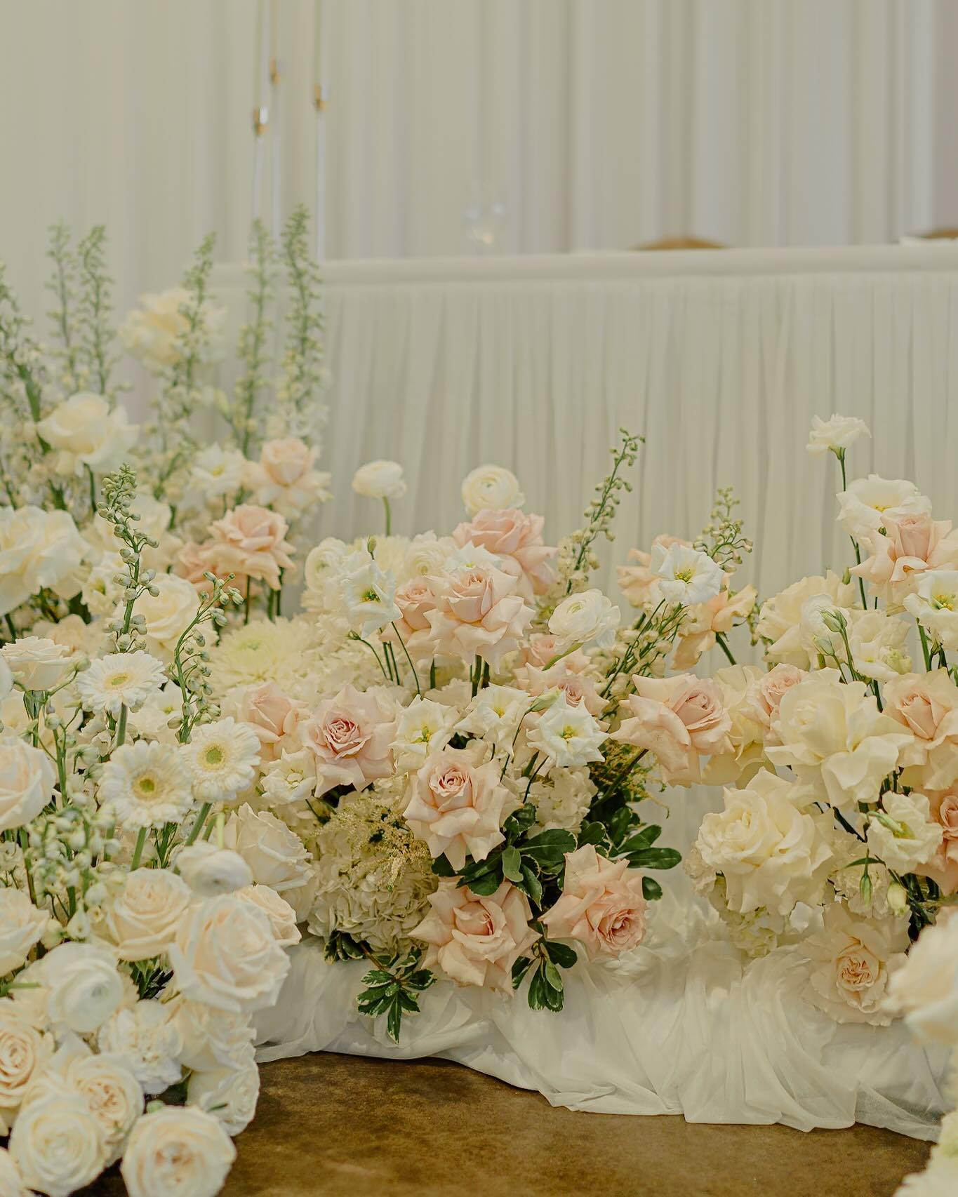 Peach rose bridal bouquet with baby's breath and hypericum berries ready for delivery